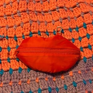 Red Lip-Shaped Pouch turns into reusable bag